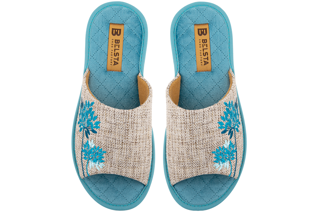 Indoor women's open slippers made of textile and quilted velvet with a magnolia design